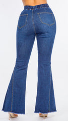 Blue flared jeans on a white background
