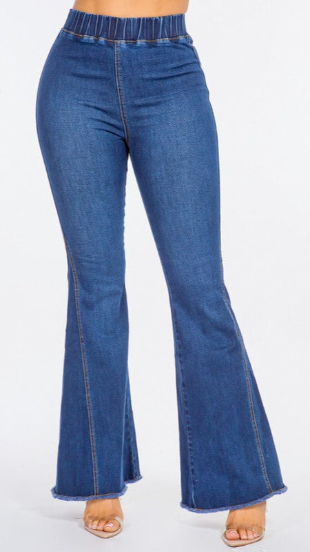 Blue denim flared jeans on a white background