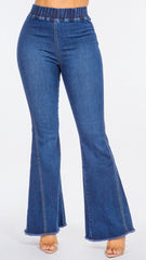 Blue denim flared jeans on a white background