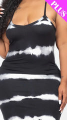 Black and white tie-dye dress worn by a model on a plain background