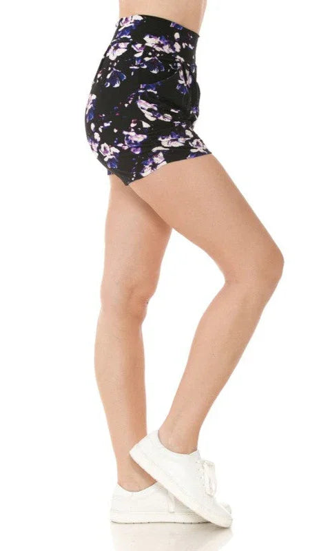 Person wearing a floral high-waisted skirt on a white background