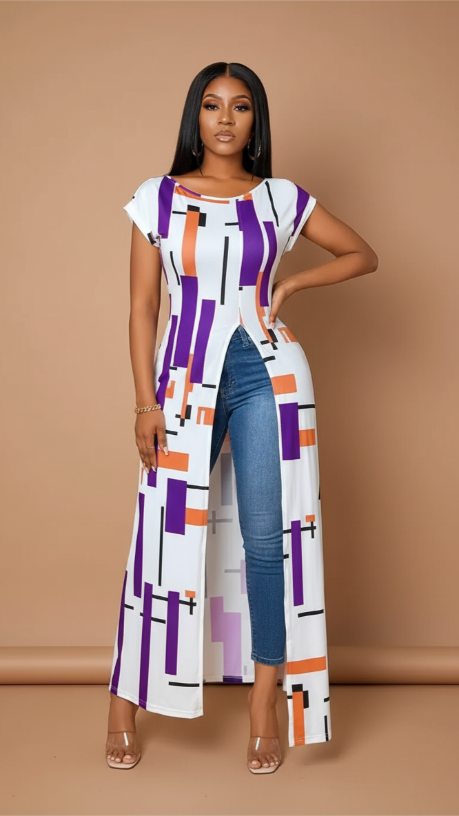 Woman wearing a long, patterned dress with a high slit on a beige background